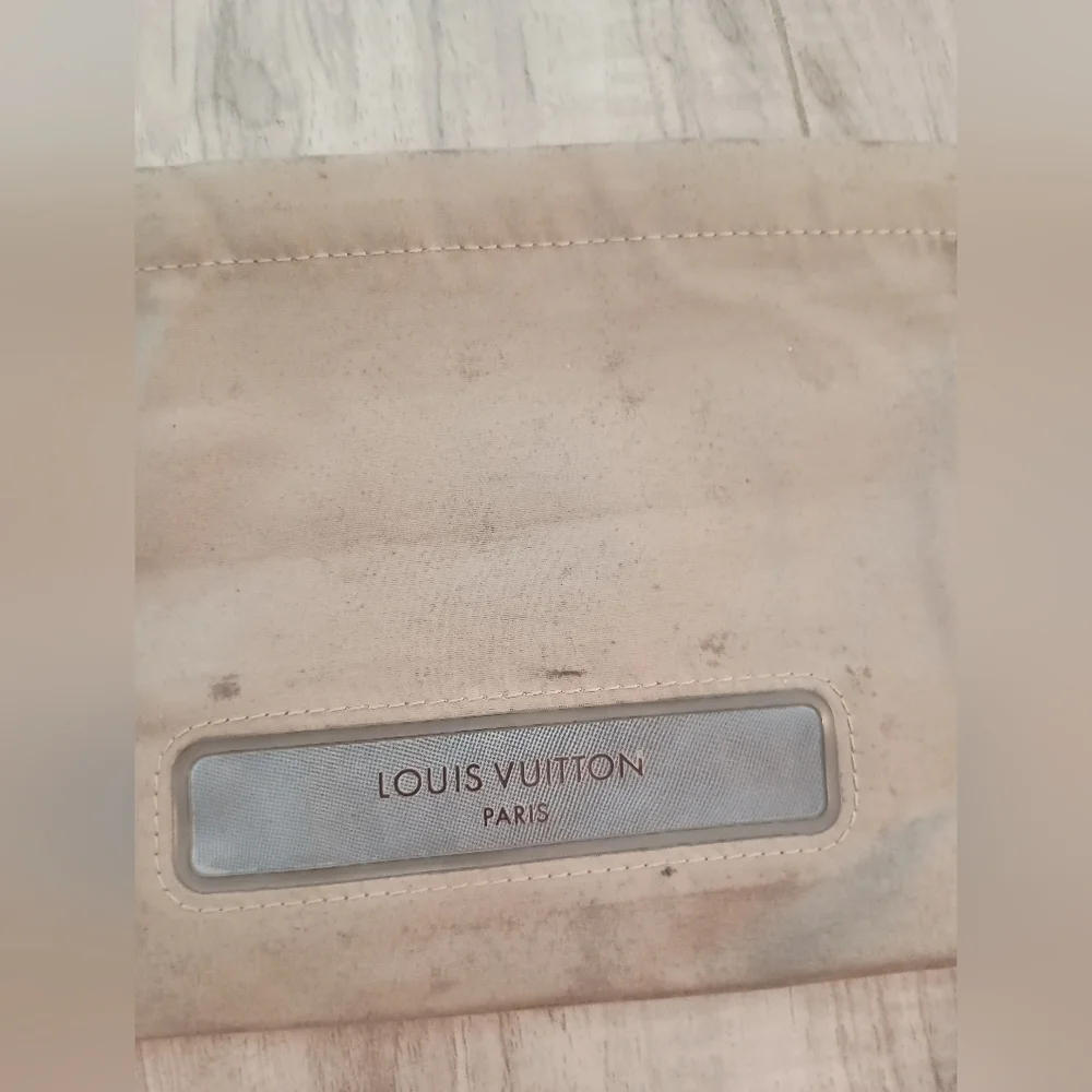 LOUIS VUITTON Truth Voyage Pouch Beige Monogram Polyester